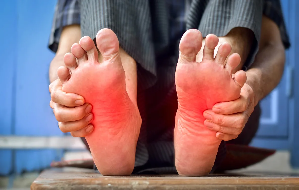 A person with burning, painful feet