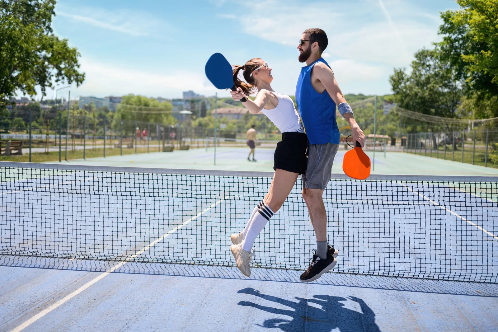 A couple celebrating after playing pickleball